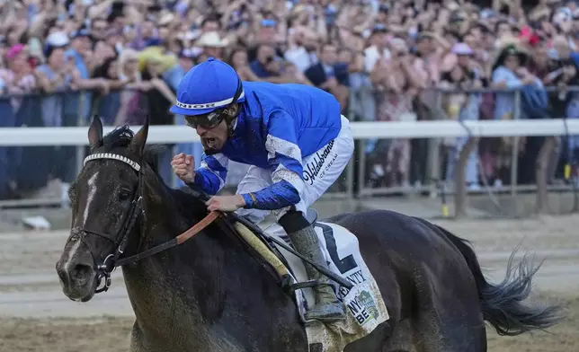 Jockey Junior Alvarado reacts aboard Sovereignty (2), as he crosses the finish line to win the 157th running of the Belmont Stakes horse race, Saturday, June 7, 2025, in Saratoga Springs, N.Y. (AP Photo/Seth Wenig)