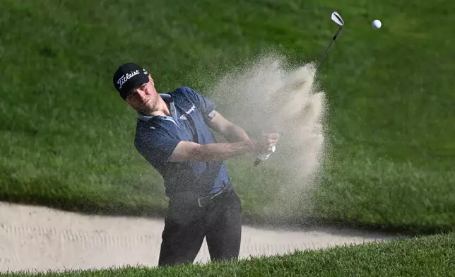 Justin Thomas hits out of the bunker on the 15th hole during the third round of the Travelers Championship golf tournament at TPC River Highlands, Saturday, June 21, 2025, in Cromwell, Conn. (AP Photo/Jessica Hill)