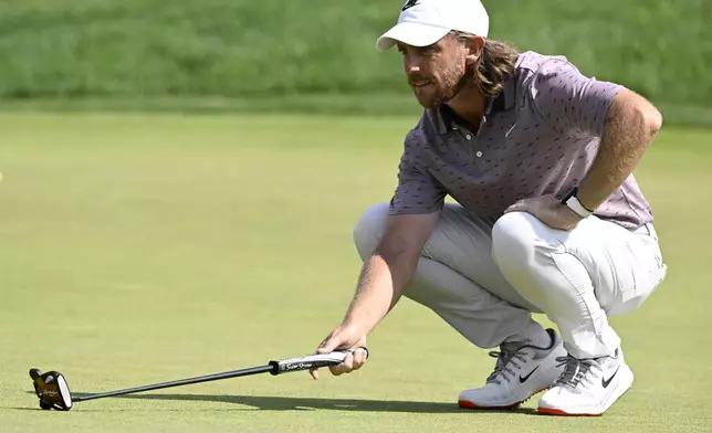 Tommy Fleetwood, of England, lines up his put on the ninth green during the third round of the Travelers Championship golf tournament at TPC River Highlands, Saturday, June 21, 2025, in Cromwell, Conn. (AP Photo/Jessica Hill)