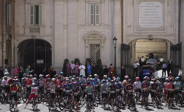Flanked by race leaders, from left, Denmark's Mads Pedersen, Mexico's Isaac Del Toro, Britain's Simon Yates and Italy's Lorenzo Fortunato, Pope Leo XIV blesses the pack before the start of the final stage of the Giro d'Italia, at the Vatican, Sunday, June 1, 2025. (AP Photo/Andrew Medichini)