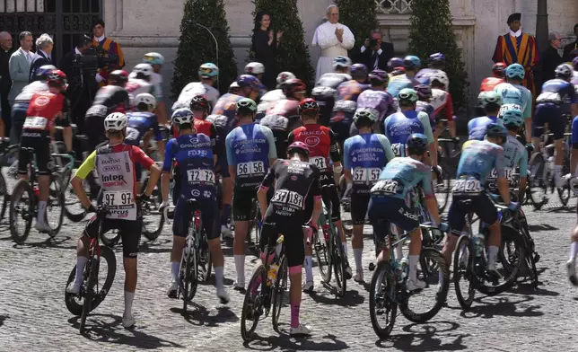 Pope Leo XIV blesses the pack before the official start of the final stage of the Giro d'Italia cycling race inside the Vatican City, Sunday, June 1, 2025. (AP Photo/Andrew Medichini)