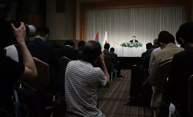 Hakuho Sho, a retired "yokozuna" or grand champion of sumo Hakuho, speaks during a press conference in Tokyo, Monday, June 9, 2025, to deliver a farewell message following the reported acceptance of his resignation and to outline his future plans. (AP Photo/Eugene Hoshiko))