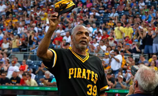 FILE - Dave Parker, a member of the 1979 Pittsburgh Pirates World Championship team, tips his cap during a pre-game ceremony honoring the team before a baseball game between the Pittsburgh Pirates and the Philadelphia Phillies in Pittsburgh, Saturday, July 20, 2019. (AP Photo/Gene J. Puskar, File)