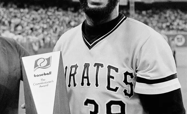 National League's Dave Parker, of the Pittsburgh Pirates, holds the trophy he received in Seattle, Tuesday, July 17, 1979, after winning the MVP award in the All Star game. (AP Photo/File)
