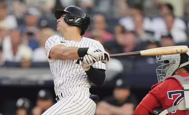 New York Yankees' Anthony Volpe hits a two-run home run during the first inning of a baseball game against the Boston Red Sox, Friday, June 6, 2025, in New York. (AP Photo/Frank Franklin II)