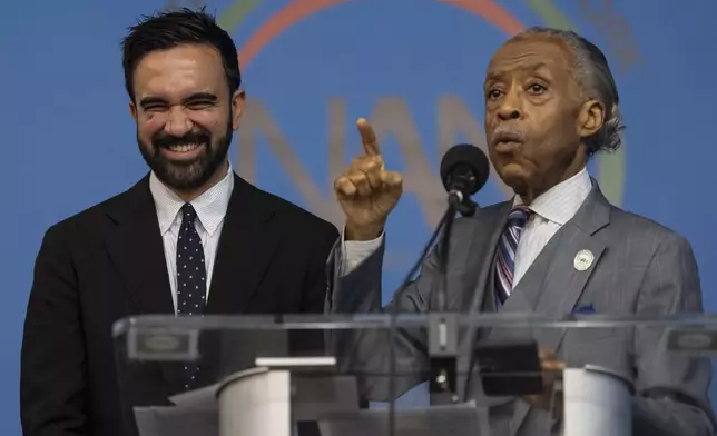 Rev. Al Sharpton, right, and Democratic mayoral candidate Zohran Mamdani, left, speak during the National Action Network's Saturday action rally at House of Justice in Harlem, Saturday, June 28, 2025, in New York. (AP Photo/Yuki Iwamura)