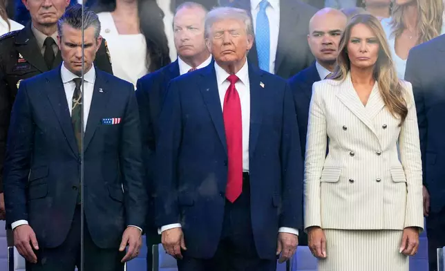 President Donald Trump, first lady Melania Trump and Defense Secretary Pete Hegseth attend a military parade commemorating the Army's 250th anniversary, coinciding with his 79th birthday, Saturday, June 14, 2025, in Washington. (AP Photo/Julia Demaree Nikhinson)