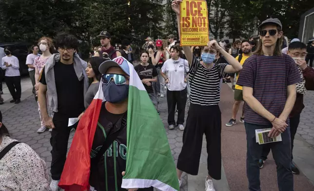 A demonstrator with carrying a Mexican flag chants during a protest against deportation by Immigration and Customs Enforcement in New York, Wednesday, June 11, 2025. (AP Photo/Yuki Iwamura)