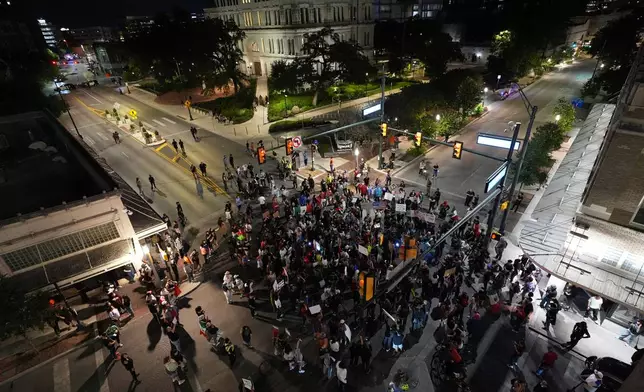 Anti ICE protesters gather in downtown San Antonio, Wednesday, June 11, 2025. (AP Photo/Eric Gay)