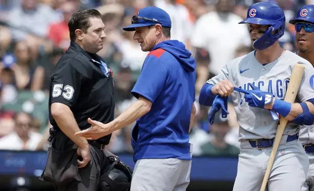 Chicago Cubs manager Craig Counsell, center, argues with home plate umpire Greg Gibson (53) after Nico Hoerner, right, was ejected for arguing after being called out on strikes during the fifth inning of a baseball game Sunday, June 8, 2025, in Detroit. Counsell was also ejected from the game. (AP Photo/Duane Burleson)