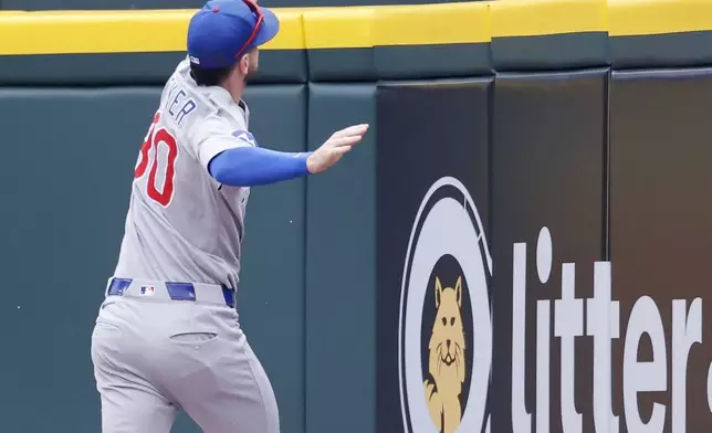 Chicago Cubs right fielder Kyle Tucker can't reach a double hit by Detroit Tigers' Spencer Torkelson that drove in two runs during the first inning of a baseball game Sunday, June 8, 2025, in Detroit. (AP Photo/Duane Burleson)