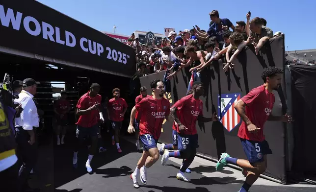 Paris Saint-Germain's players enter the field to warm up prior to the Club World Cup group B soccer match between PSG and Atletico Madrid in Pasadena, Calif., Sunday, June 15, 2025. (AP Photo/Jae Hong)