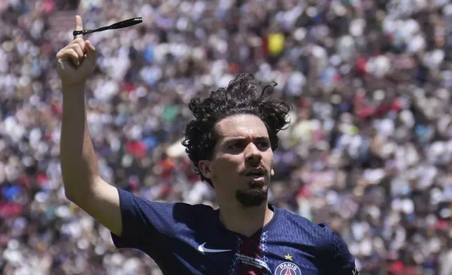 Paris Saint-Germain's Vitinha celebrates scoring his side's second goal during the Club World Cup group B soccer match between PSG and Atletico Madrid in Pasadena, Calif., Sunday, June 15, 2025. (AP Photo/Jae Hong)