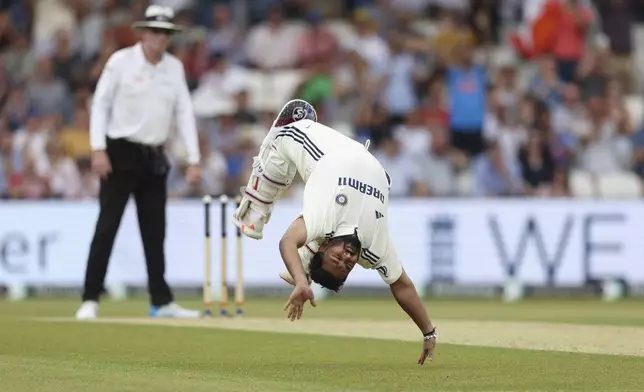 India’s Rishabh Pant does a cartwheel to celebrate after scoring a century on day two of the first cricket test match between England and India at Headingley in Leeds, England, Saturday, June 21, 2025, (AP Photo/Scott Heppell)