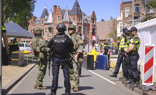 Security patrol around the perimeter of the venue in The Hague, Netherlands, Monday, June 23, 2025 ahead of the upcoming NATO summit. (AP Photo/Patrick Post)