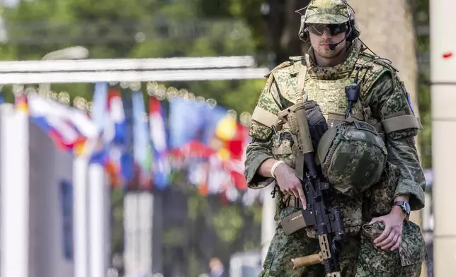 Security patrol around the perimeter of the venue in The Hague, Netherlands, Monday, June 23, 2025 ahead of the upcoming NATO summit. (AP Photo/Geert Vanden Wijngaert)