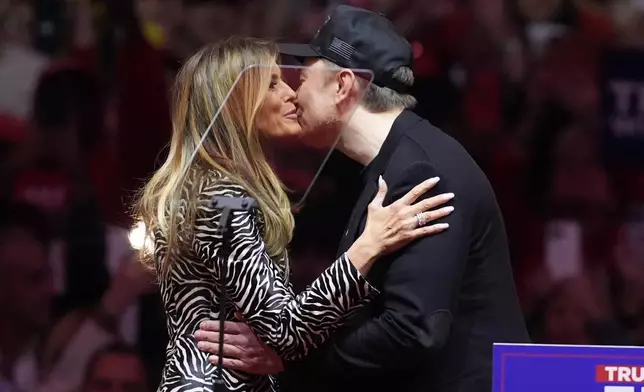 FILE - Former first lady Melania Trump greets Elon Musk before Republican presidential nominee former President Donald Trump arrives at a campaign rally at Madison Square Garden, Oct. 27, 2024, in New York. (AP Photo/Evan Vucci, File)
