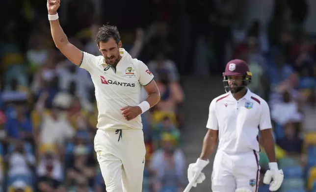 Australia's Mitchell Starc celebrates the dismissal of West Indies' Kraigg Brathwaite on day three of the first cricket Test match at Kensington Stadium in Bridgetown, Barbados, Friday, June 27, 2025. (AP Photo/Ricardo Mazalan)