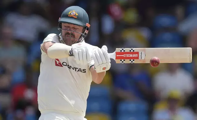 Australia's Travis Head plays a shot against West Indies on day three of the first cricket Test match at Kensington Stadium in Bridgetown, Barbados, Friday, June 27, 2025. (AP Photo/Ricardo Mazalan)