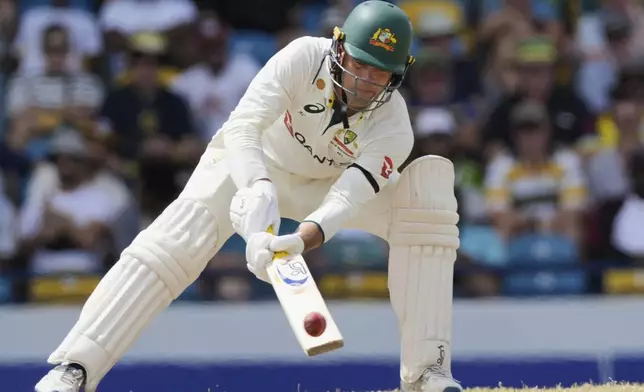 Australia's Alex Carey plays a shot from a delivery of West Indies' Shamar Joseph on day three of the first cricket Test match at Kensington Stadium in Bridgetown, Barbados, Friday, June 27, 2025. (AP Photo/Ricardo Mazalan)
