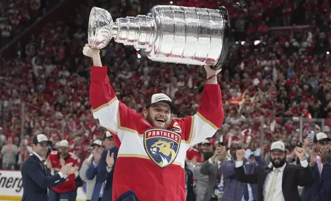 Florida Panthers captain Aleksander Barkov (16) raises the Stanley Cup after defeating the Edmonton Oilers in Game 6 of the NHL hockey Stanley Cup Final Tuesday, June 17, 2025, in Sunrise, Fla. (AP Photo/Lynne Sladky)