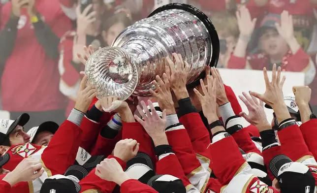 The Florida Panthers raise the Stanley Cup after defeating the Edmonton Oilers in Game 6 of the NHL hockey Stanley Cup Final in Sunrise, Fla., Tuesday, June 17, 2025. (Nathan Denette/The Canadian Press via AP)