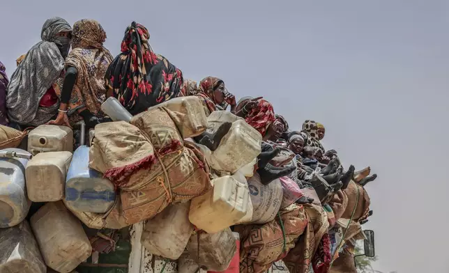 Refugees arrive at the Tine transit camp in Chad's Wadi Fara province Saturday, May 3, 2025. (AP Photo/Caitlin Kelly)