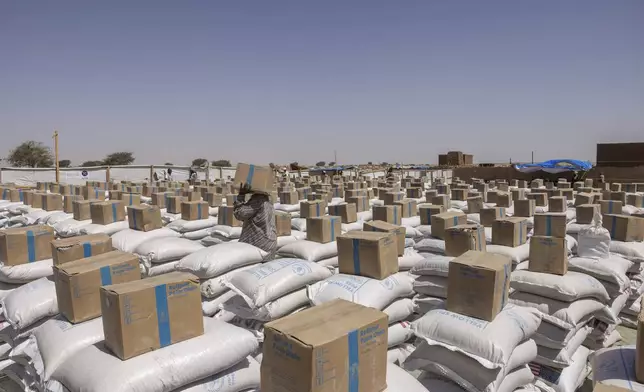 World Food Program supplies wait for distribution in Adre, Chad, Thursday, May 8, 2025. (AP Photo/Caitlin Kelly)