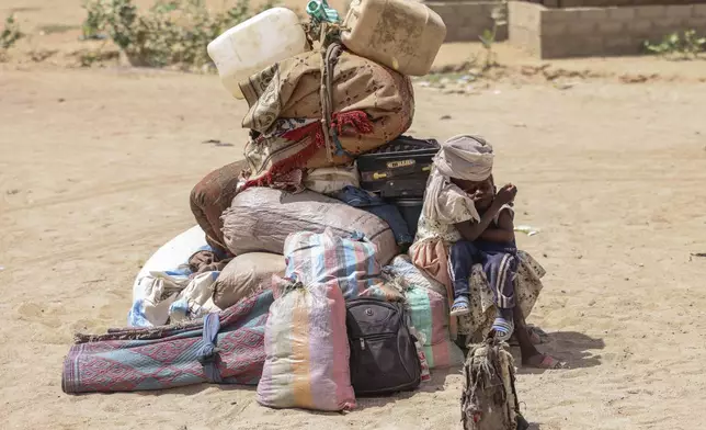 Refugees arrive at the border between Chad and Sudan before going to the Tine transit camp in Chad's Wadi Fara province Sunday, May 4, 2025. (AP Photo/Caitlin Kelly)