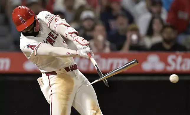 Los Angeles Angels' Jo Adell breaks his bat on a single in the seventh inning of a baseball game against the Boston Red Sox, Tuesday, June 24, 2025, in Anaheim, Calif. (AP Photo/Jayne Kamin-Oncea)