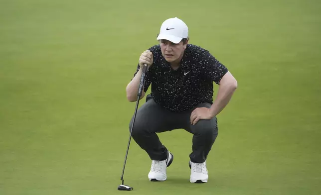Robert MacIntyre, of Scotland, lines up a putt on the 18th hole during the final round of the U.S. Open golf tournament at Oakmont Country Club Sunday, June 15, 2025, in Oakmont, Pa. (AP Photo/Gene J. Puskar)