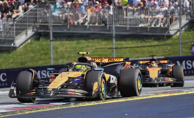 McLaren driver Lando Norris of Britain leads the race in front of McLaren driver Oscar Piastri of Australia during the Austrian Formula One Grand Prix in Spielberg, Austria, Sunday, June 29, 2025. (AP Photo/Darko Bandic)