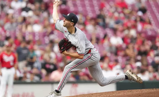 Minnesota Twins pitcher David Festa throws during the second inning of a baseball game against the Cincinnati Reds, Tuesday, June 17, 2025, in Cincinnati. (AP Photo/Jeff Dean)