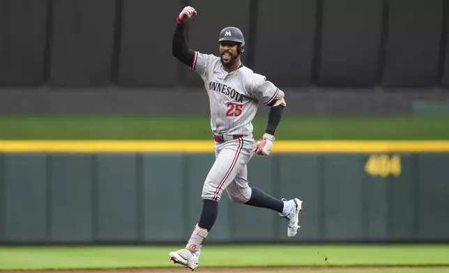 Minnesota Twins' Byron Buxton rounds the bases after hitting a solo home run during the third inning of a baseball game against the Cincinnati Reds, Tuesday, June 17, 2025, in Cincinnati. (AP Photo/Jeff Dean)