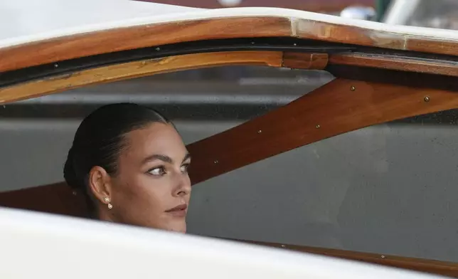 Vittoria Ceretti leaves a hotel ahead of the anticipated wedding celebrations of Jeff Bezos and Lauren Sanchez, in Venice, Italy, Friday, June 27, 2025. (AP Photo/Antonio Calanni)