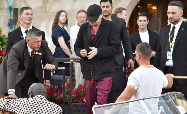 Leonardi Di Caprio and leaves a hotel during celebrations for Jeff Bezos and Lauren Sanchez Bezos' wedding, in Venice, Saturday, June 28, 2025. (AP Photo/Luigi Costantini)