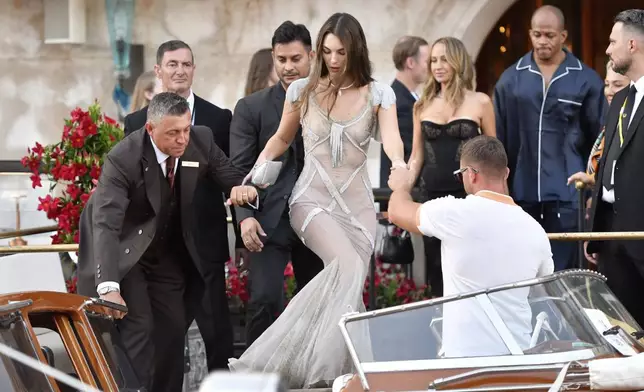 Vittoria Cerretti leaves a hotel during celebrations for Jeff Bezos and Lauren Sanchez Bezos' wedding, in Venice, Saturday, June 28, 2025. (AP Photo/Luigi Costantini)
