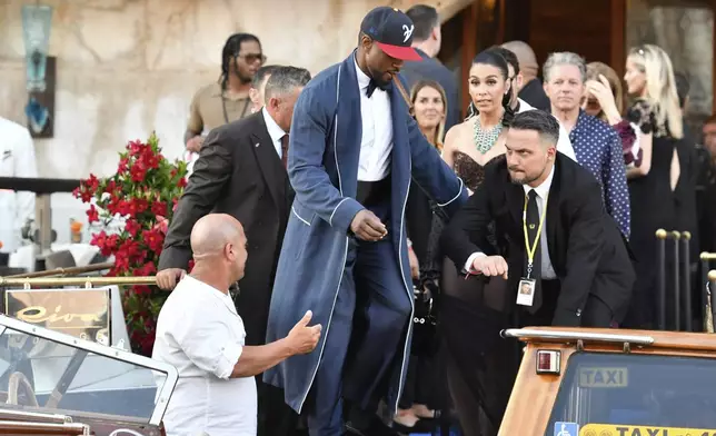 Husher leaves a hotel during celebrations for Jeff Bezos and Lauren Sanchez Bezos' wedding, in Venice, Saturday, June 28, 2025. (AP Photo/Luigi Costantini)