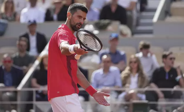 Serbia's Novak Djokovic reacts as he plays against Britain's Cameron Norrie during their fourth round match of the French Tennis Open at the Roland-Garros stadium in Paris, Monday, June 2, 2025. (AP Photo/Thibault Camus)