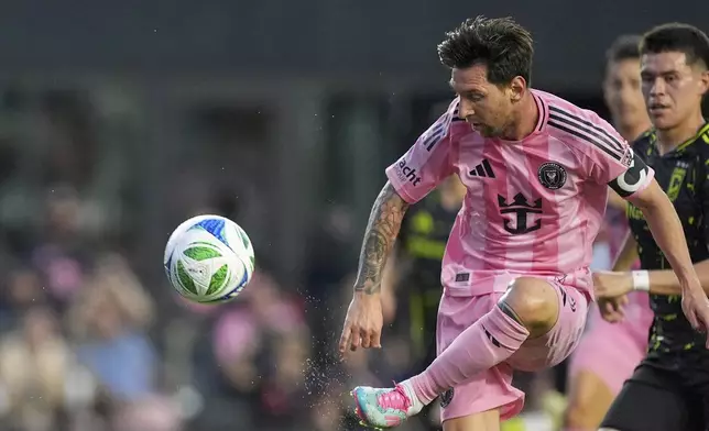 Inter Miami forward Lionel Messi (10) scores his side's third goal against Columbus Crew during the first half of an MLS soccer match, Saturday, May 31, 2025, in Fort Lauderdale, Fla. (AP Photo/Rebecca Blackwell)