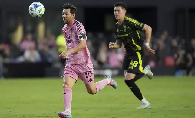 Inter Miami forward Lionel Messi (10) chases down a pass pursued by Columbus Crew defender Cesar Ruvalcaba (48) during the first half of an MLS soccer match, Saturday, May 31, 2025, in Fort Lauderdale, Fla. (AP Photo/Rebecca Blackwell)