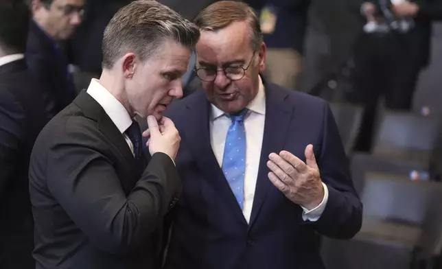 Germany's Defense Minister Boris Pistorius, right, speaks with Sweden's Defense Minister Pal Jonson during a meeting of NATO defense ministers at NATO headquarters in Brussels, Thursday, June 5, 2025. (AP Photo/Virginia Mayo)