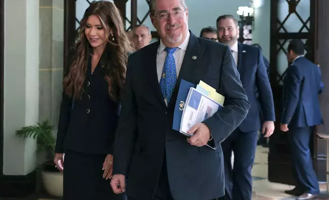 U.S. Homeland Security Secretary Kristi Noem, left, and Guatemalan President Bernardo Arevalo walk inside the National Culture Palace to their meeting in Guatemala City, Thursday, June 26, 2025. (Anna Moneymaker/Pool photo via AP)
