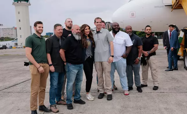 U.S. Homeland Security Secretary Kristi Noem poses for photos with air marshals and security officials at La Aurora International Airport in Guatemala City, June 26, 2025. (Anna Moneymaker/Pool Photo via AP)
