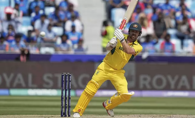 FILE - Australia's Travis Head plays a shot during the ICC Champions Trophy semifinal cricket match between India and Australia at Dubai International Cricket Stadium in Dubai, United Arab Emirates, Tuesday, March 4, 2025. (AP Photo/Altaf Qadri, File)