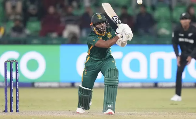 FILE - South Africa's captain Temba Bavuma plays a shot during the ICC Champions Trophy semifinal cricket match between New Zealand and South Africa at Gaddafi Stadium in Lahore, Pakistan, Wednesday, March 5, 2025. (AP Photo/Anjum Naveed, File)