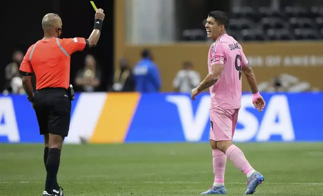 Inter Miami's Luis Suarez receives a yellow card during the Club World Cup round of 16 soccer match between PSG and Inter Miami in Atlanta, Sunday, June 29, 2025. (AP Photo/Brynn Anderson)