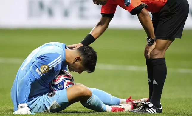An official checks on Inter Miami's Oscar Ustari, left, during the Club World Cup round of 16 soccer match between PSG and Inter Miami in Atlanta, Sunday, June 29, 2025. (AP Photo/Brynn Anderson)