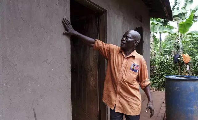 Simon Tigawalana shows some of EarthEnable's work on his home on May 16, 2025, in Jinja, Uganda. (AP Photo/Hajarah Nalwadda)