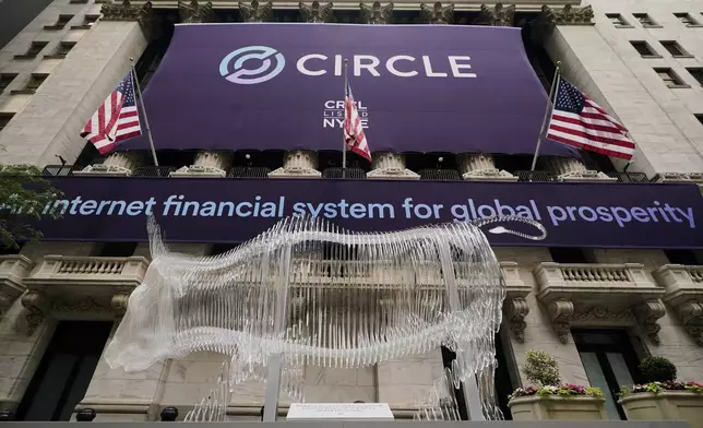 A bull sculpture is displayed outside the New York Stock Exchange for the expected Circle IPO, Thursday, June 5, 2025. (AP Photo/Richard Drew)